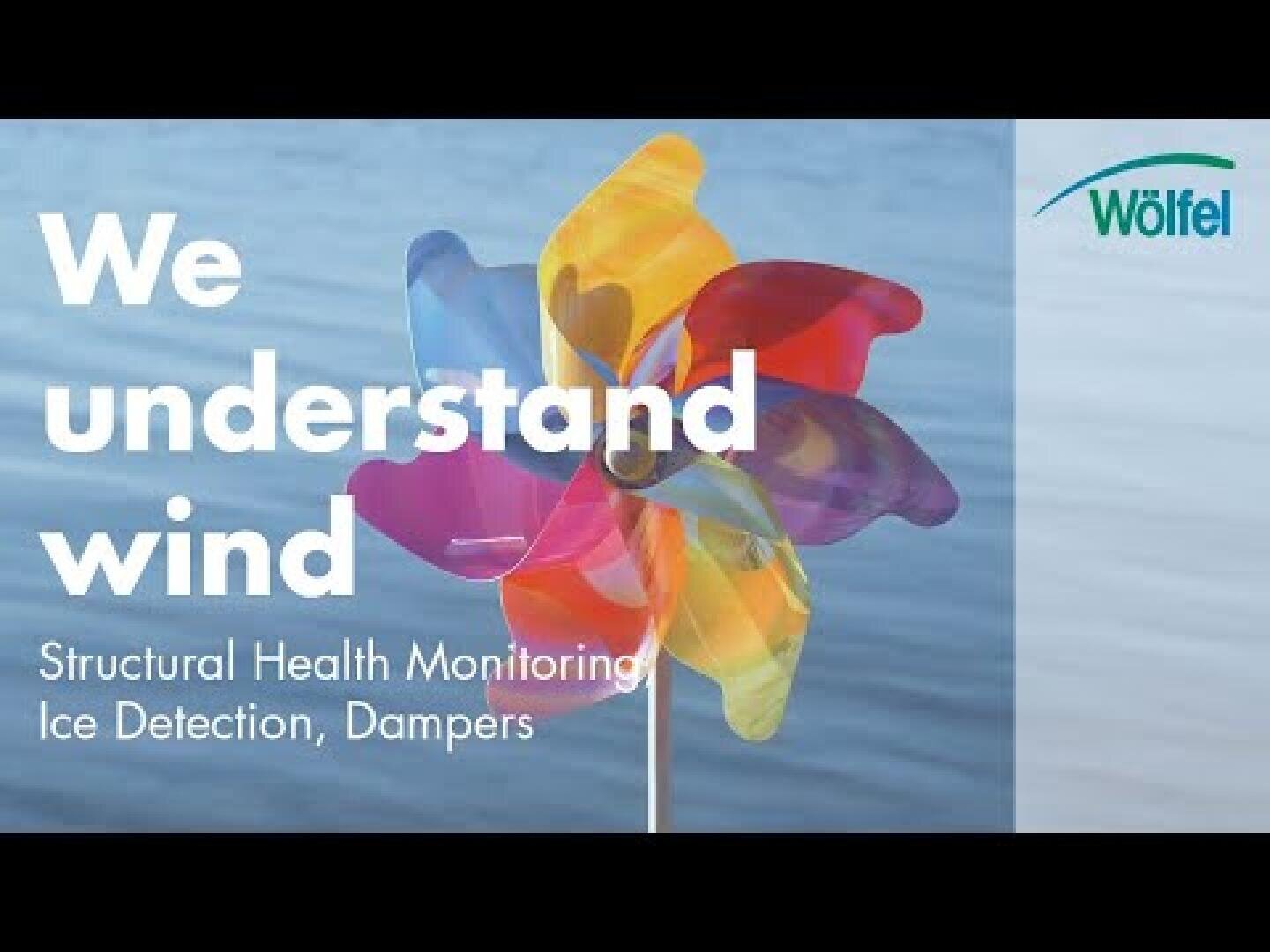 A colorful pinwheel spins in front of a blurred blue background with the text: We understand wind. Structural Health Monitoring, Ice Detection, Dampers. The Wölfel logo appears in the upper right corner.