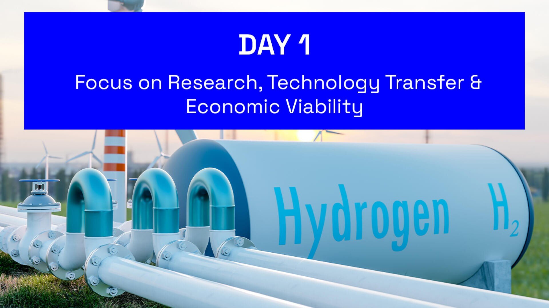 A large hydrogen storage tank labeled Hydrogen H2 is connected to pipes outdoors, with wind turbines in the background. A blue banner reads: Day 1: Focus on Research, Technology Transfer & Economic Viability.
